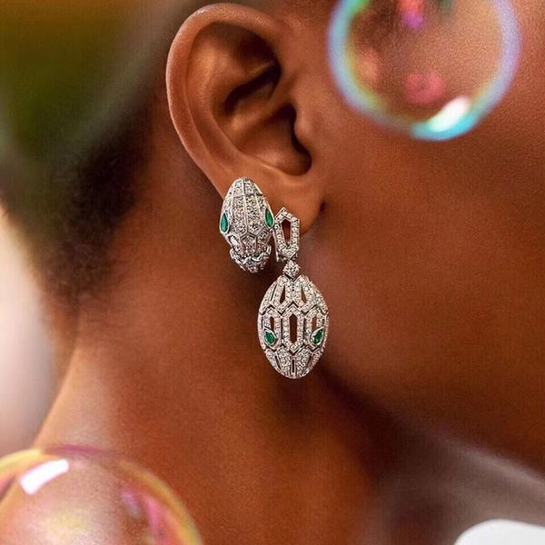 

European and American fashion green eye snake head earrings silver needle female full diamond zircon personality snake earrings short hollow