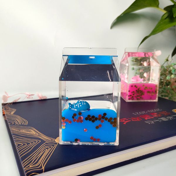 

crystal milk carton into oil to arrange a lovely sea doll to arrange an office desk