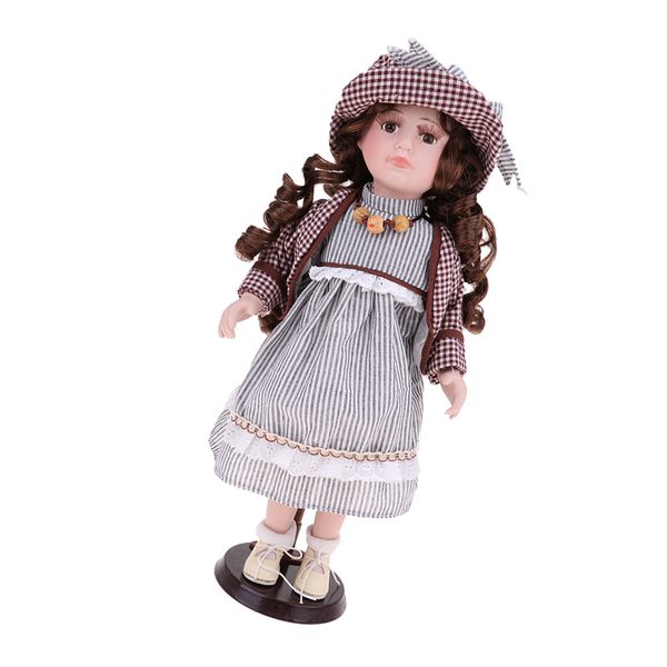 

викторианский фарфоровые куклы, стоя с lace полосатый платье и matching hat