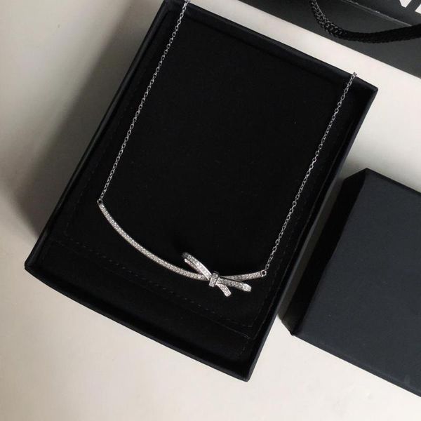 

bow silver color necklace, Golden;silver