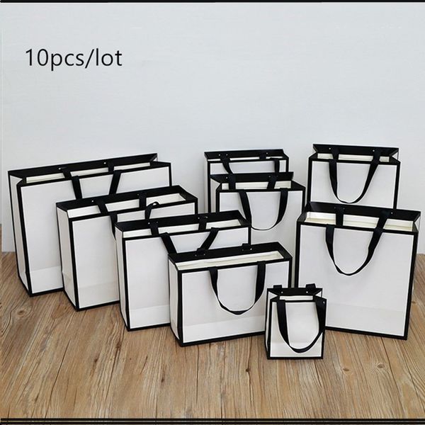 

gift bag with ribbon hands gift box cake candy boxes kraft paper cardboard box packaging wedding birthday party favors