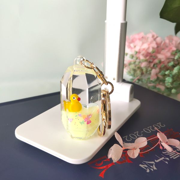 

creative gifts into the oil floating doll pendant hexagonal cylindrical shape into the oil key chain