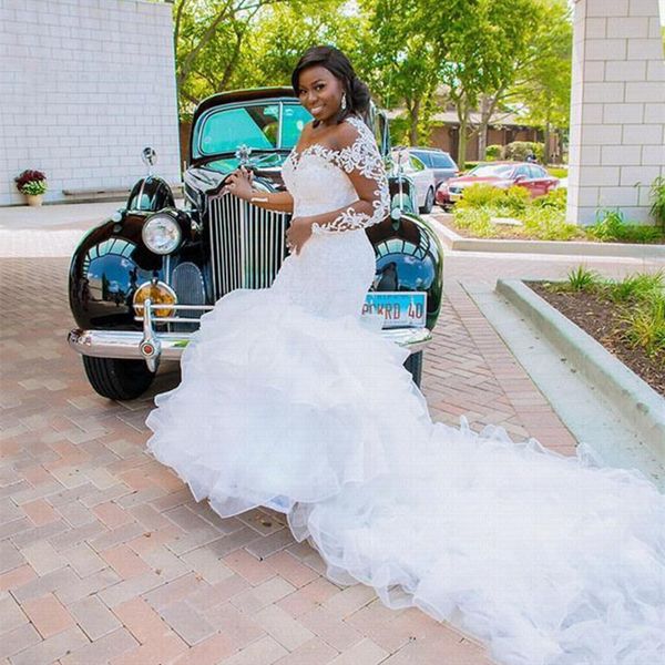 

2022 long train african mermaid wedding dresses bridal gowns ruffle tiered skirt lace full sleeve chapel illusion bride dress appliques vest, White