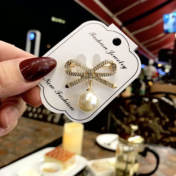 

fashion temperament simple imitation pearl bow brooch female clothes fixed pin brooch clothing accessories silk scarf buckle 1pc, Gray