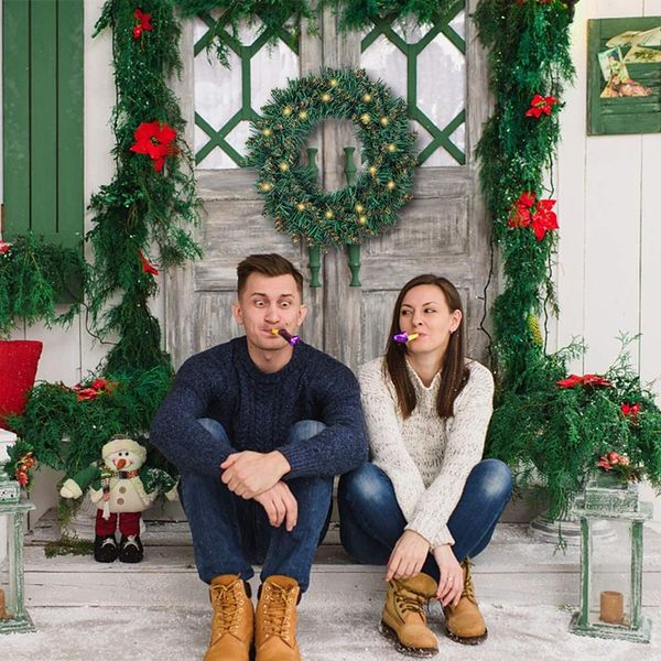 

artificial christmas wreath with christmas spruce for front door decoration and party
