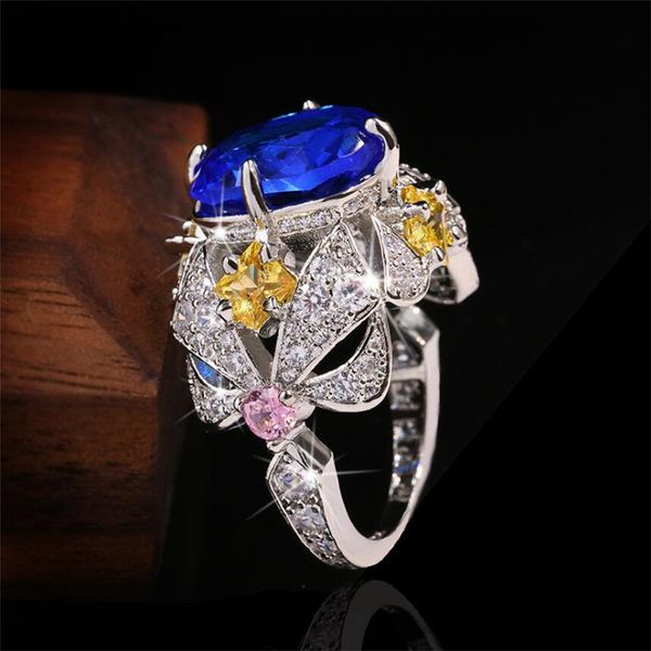 Choucong Neuer funkelnder Luxus-Schmuck, 925er-Sterlingsilber, mehrfarbig, blauer Saphir, CZ-Diamant, Edelsteine, Blumen-Damen-Ehering