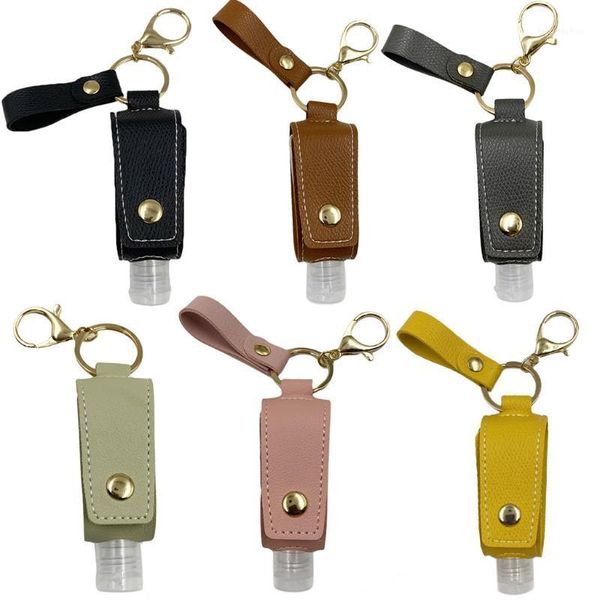 

travel hand sanitizer empty refillable bottle with faux leather holder keychain1