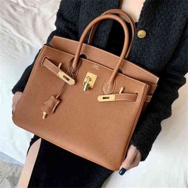 

designer herme handbags h home aima platinum lock togo leather litchi grain cowhide hand sewn wax thread portable women's leisure bag h