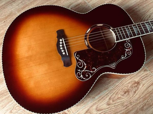 

new for 2022 blueson 43" 6-string acoustic guitar sun color. spruce veneer and maple back and sides, rosewood fretboard.