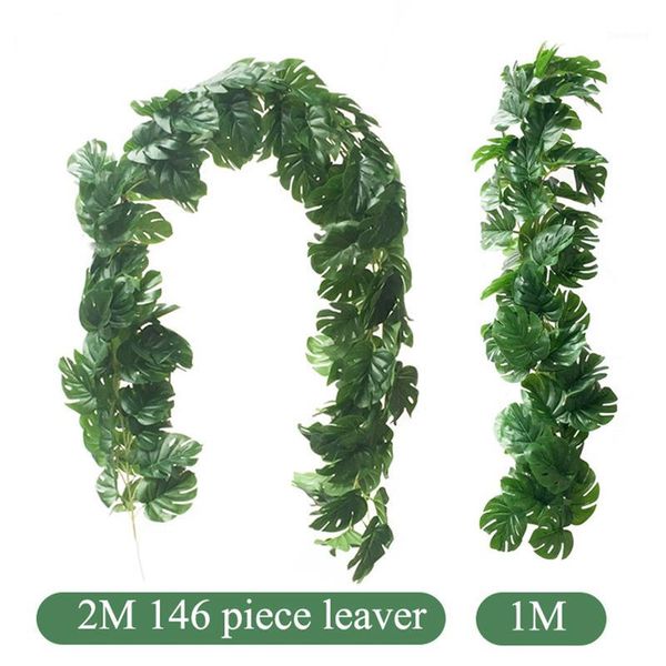 

fake tropical palm leaves grass vine artificial jungle plants turtle leaf rattan simulation wedding party home table arch decor1