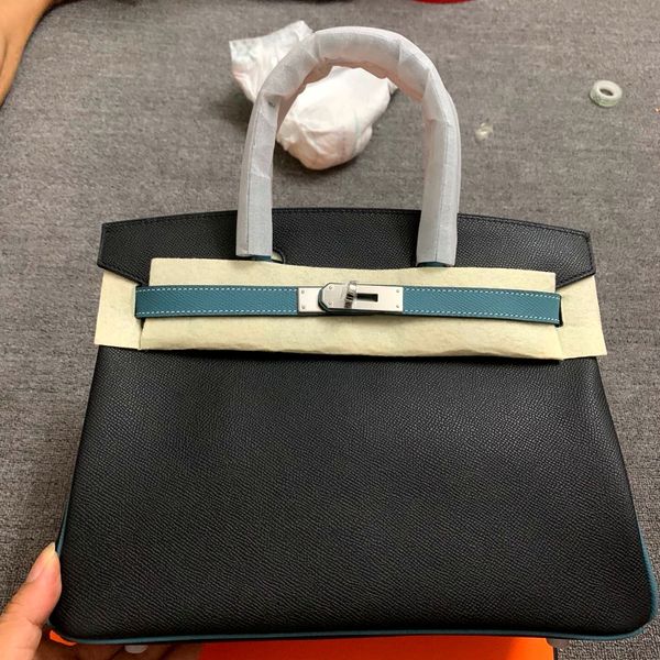 

by order only,half handmadequality,35cm,2tones epsom leather designers purse,wax stitching,gold and silver hardware,contact for details