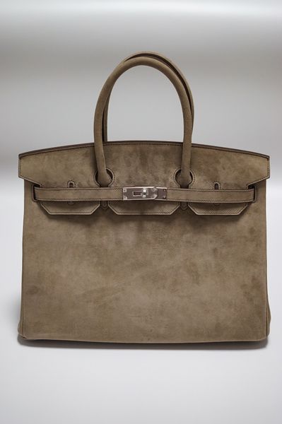 

by order only,fylly handmadequality,25cm,wotnes,suede leather design purse,wax stitching,gold and silver hardware,contact for details