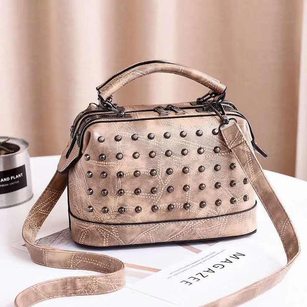 

new fashion rivet shoulder portable messenger bag