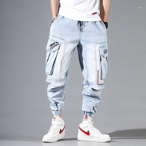 

fashion streetwear men jeans light blue loose fit multi pockets cargo pants harem jeans men embroidery designer hip hop joggers1