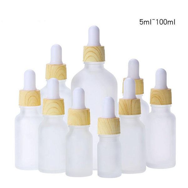

wholesale frosted clear glass bottles with droppers 5-100ml glass essential oil bottle with plastic wooden grain cover and glass pipette