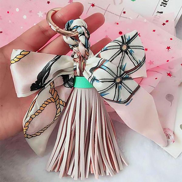 

1pcs bowknot ribbon spring coil leather tassel key chain diy making decorative accessories phone bag craft pendant fringe trim h wmtsby