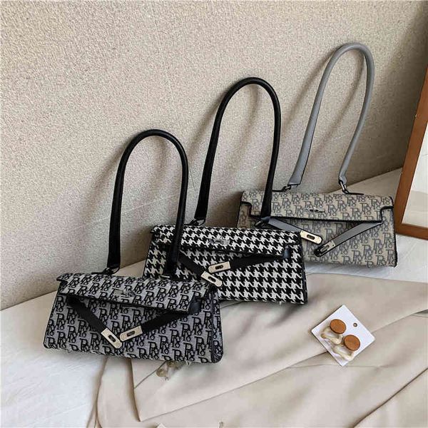 

2022 latest luggage factory wholesale small women's thousand bird lattice armpit single shoulder buckle bag