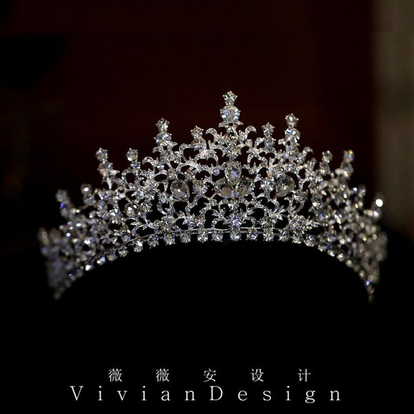 

heavy diamond silver bridal crown, hair ornament and make-up elegant crown show host headdress wedding dress