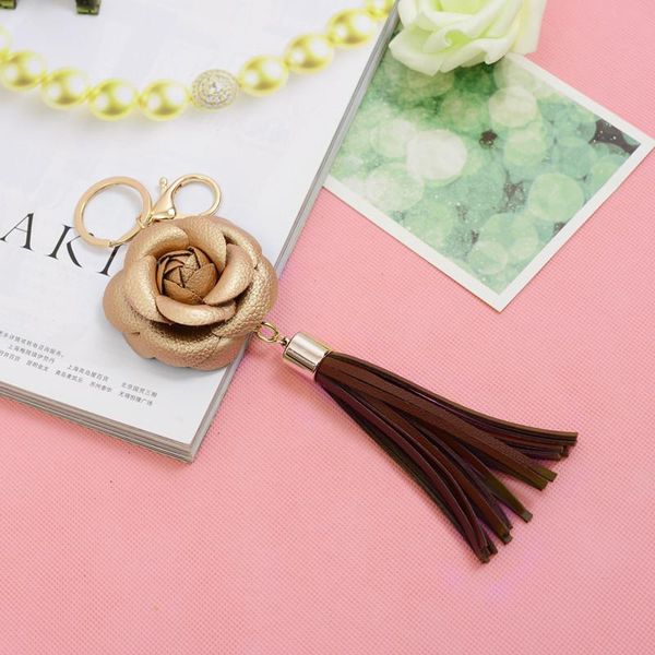 

1pcs faux leather flowers keychain tassel fringe pendant woman diy bag craft accessories tassels trim girl small gift ornament h wmtyxy