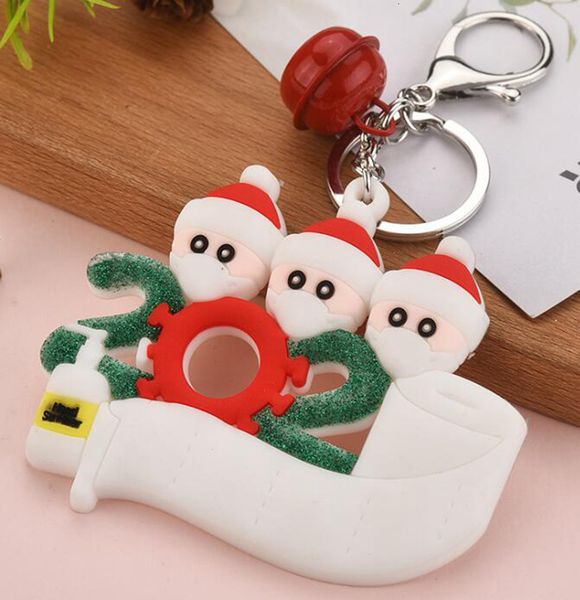 

pvc christmas ornaments keychain survivor family key chain with face masks toys pendants xmas key ring snowman with hand sanitizer gga3759-4