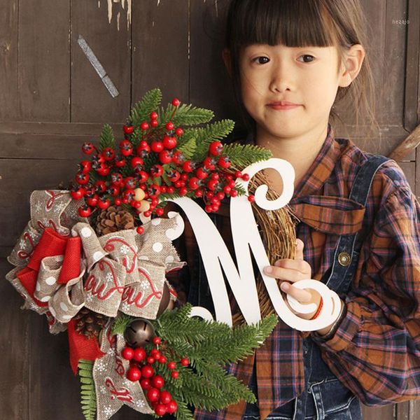 

christmas letter wreath with rusty jingle bells and pine cones on grapevine base 30cm dia1