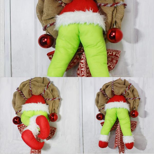

small thief burlap stealer wreath with christmas grinchs legs and holiday garland ornaments for front door xmas decor