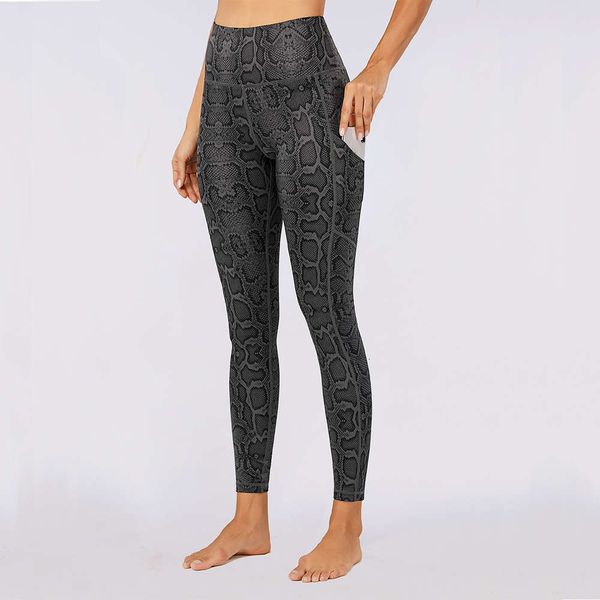 

python print high waist tuck in black snake sports yoga pants