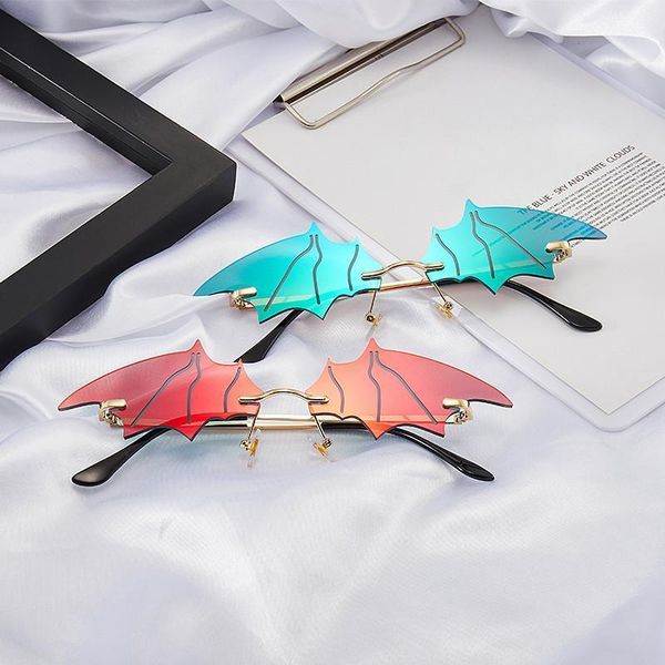 

new arrival 2020 futuristic sunglasses women small bat shape sun glasses cat eye frameless glasses feminino1, White;black