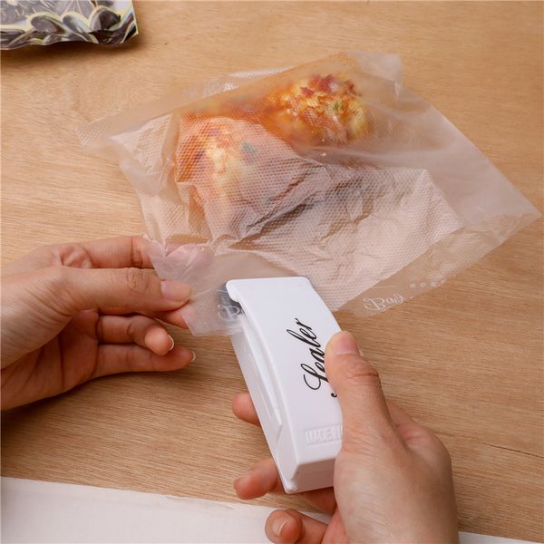 

mini portable heat sealing machine travel hand pressure household impulse sealer seal packing plastic bag food saver storage tools vt1919