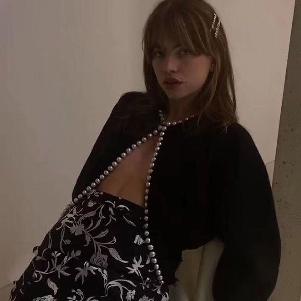 

woman peal long sleeve cardigan sweater black white