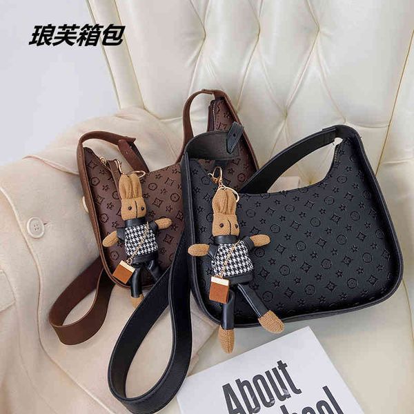 

2022 factory wholesale embossed women's same messenger small rabbit pendant bag