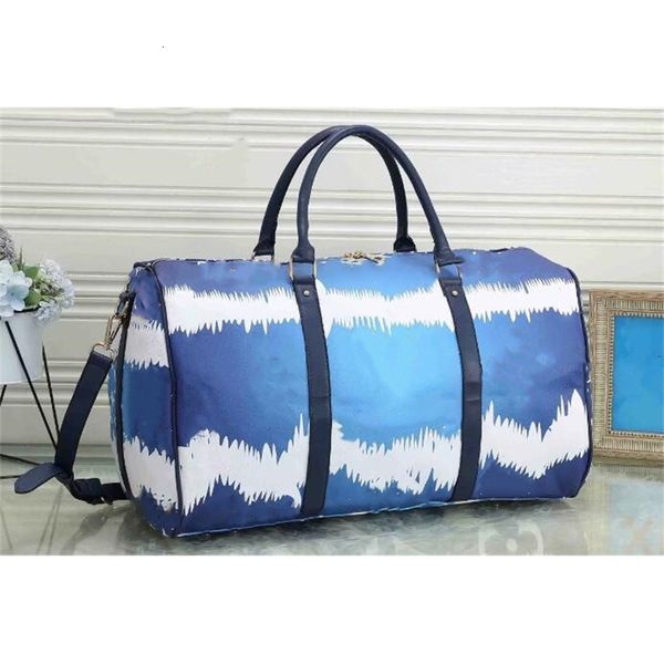 

2021 55cm large capacity travel sale quality women men shoulder duffel bags carry on luggage bottom rivets with lock head