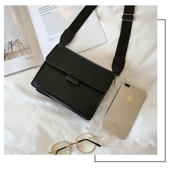 

cross body small square bag slung over one shoulder