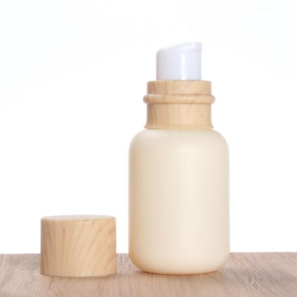 Flacone con tappo a grana di legno da latte di capra da 50 ml Flacone con testa della pompa a emulsione da 110 ml Bottiglia con tappo interno da 150 ml