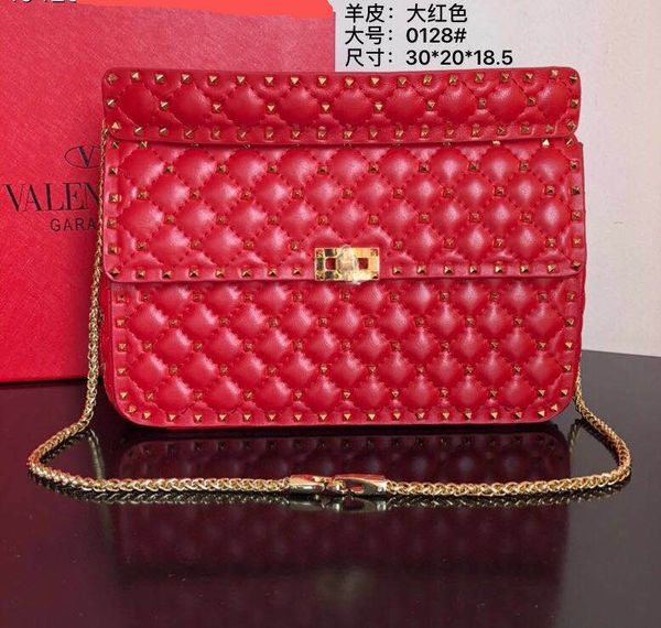 

new fashionable cowhide material crossbody bag. tie-in rivet decoration. more fashionable and foreign.factory direct sales delivery.a0128