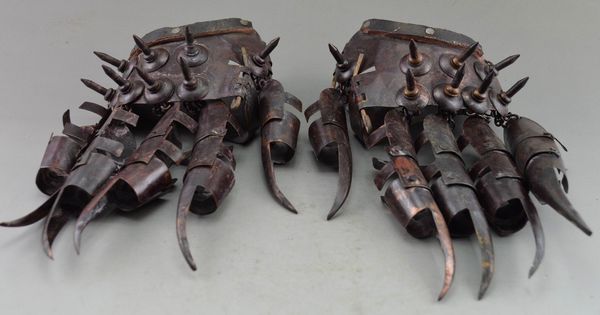 

ancient collectibles decorated old copper hammered protective gloves in war