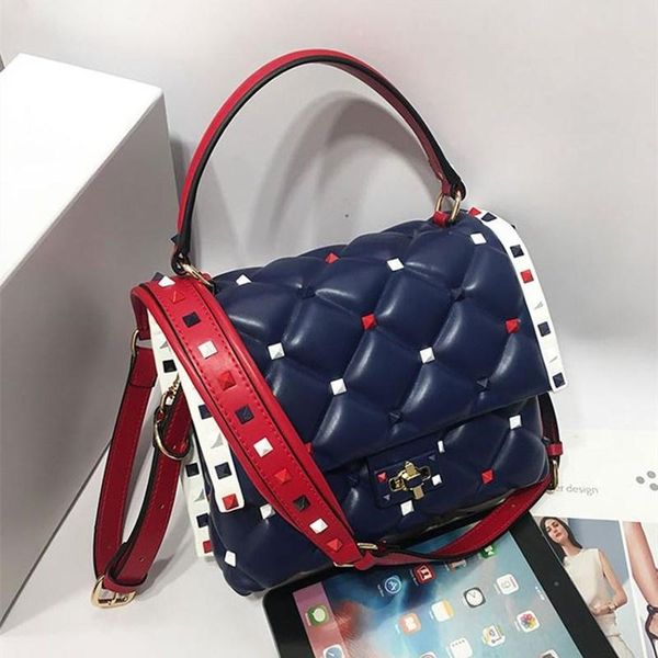 

bag design sense 2020 new female soil handbag all-match leather home rivet bag