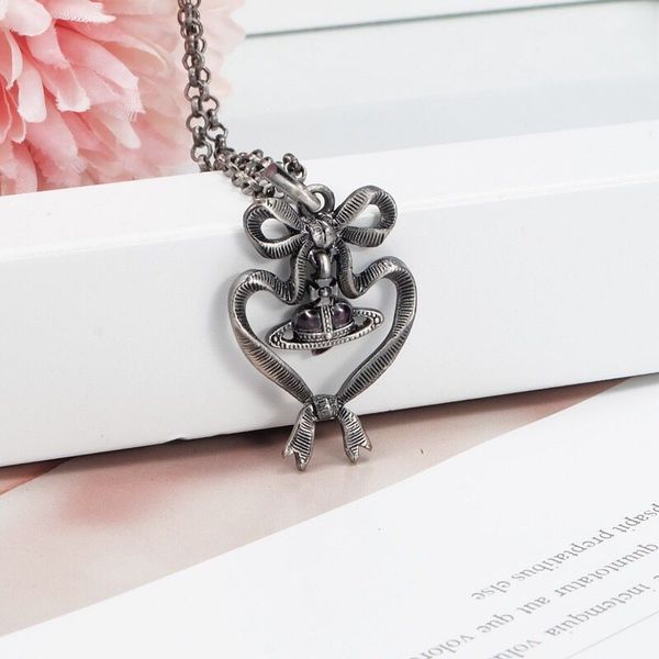 

small bow love heart necklace antique silver distressed bow hanging purple heart saturn necklace