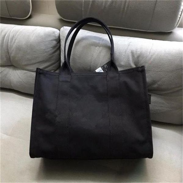 

2020 new fashion trend, versatile, niche design canvas tote bag, cowhide with fabric wide shoulder belt women's shopping bag