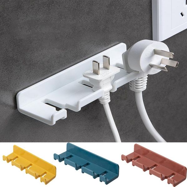 

1/2pcs punch plug sticker holder wall fixer power strip holders storage sockets wall shelf stand holder hanger