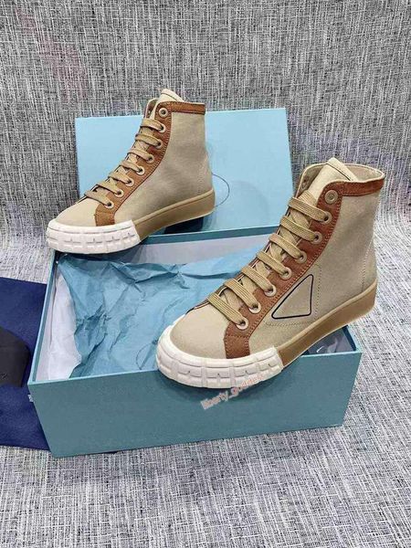 

rubber platform inspired motocross defines the unusual design of these nylon gabardine sneakers. the logo triangle with box, Black;red