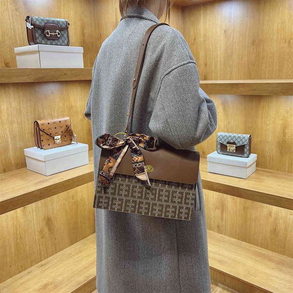 

2022 factory wholesale new model printed silk scarf bow color matching buckle small square bag women's bag