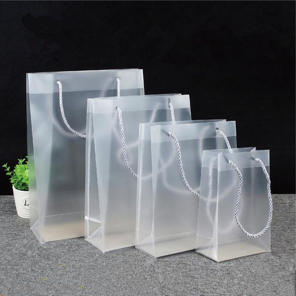 

gift wrap 100pcs/lot frosted pvc plastic bags with handles party favors handbag bag fashion pp can custom logo
