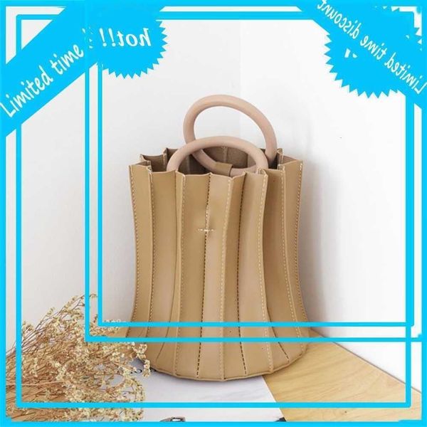 

korean niche design bucket simple versatile three dimensional fold handbag fashion wooden ring one shoulder messenger bag