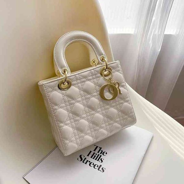 

2022 factory outlet fashion korean car sewing lingge hand-held diana painted women's one shoulder oblique span small square bag 9um5