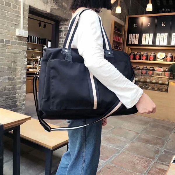 

2021 trendy black nylon travel bags for women striped shoulder strap travel duffel bags women large tote bagpack1