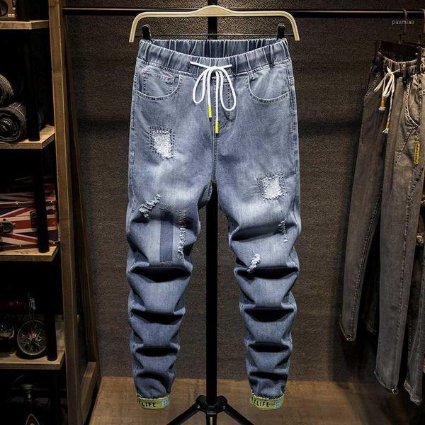 

large size fashion streetwear men jeans vintage blue pants harem trousers joggers jeans men beam feet hole elastic waist pants1