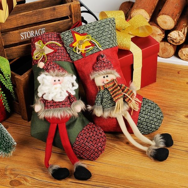 

christmas decorations santa claus snowman stockings presents christmas stockings decorated with candy gift bags