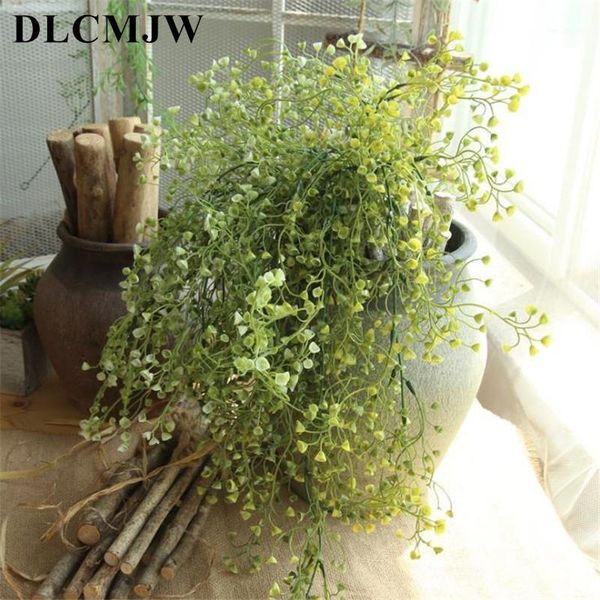 

artificial plants grass wall hanging grass fake hanging vine plant leaves garland home garden wall wedding party decoration1