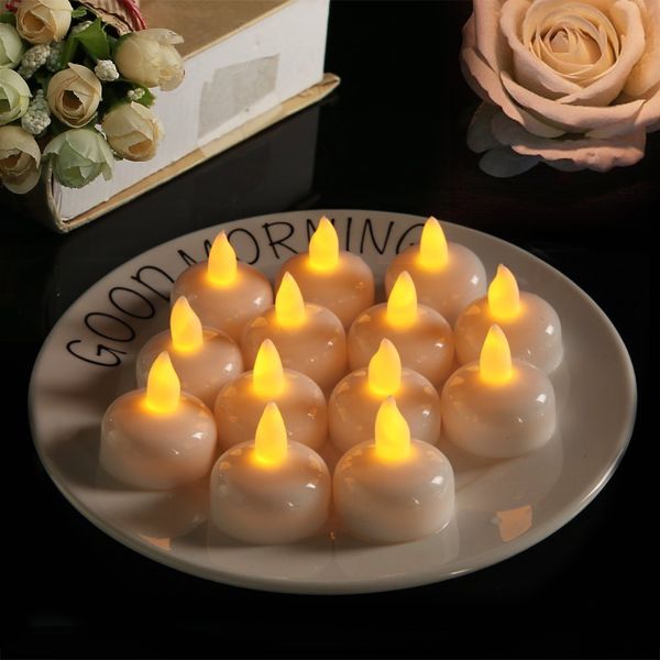

pack of 12 flickering waterproof flameless floating tealights warm white battery flickering led tea lights candles wedding party
